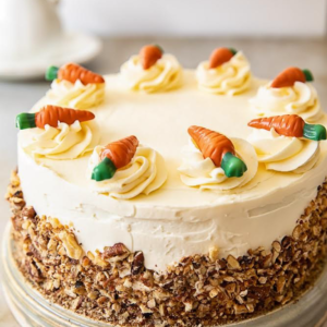 Carrot cake with butter cream icing  With pecans toppings